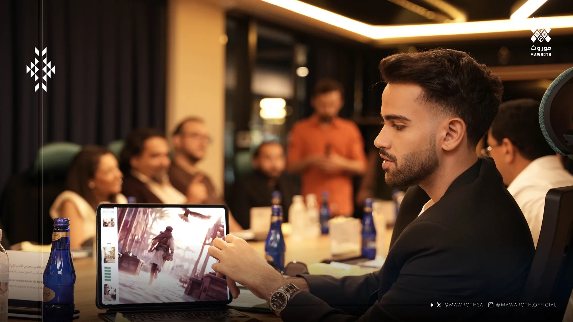 Mawroth executive reviewing interactive game artwork on an iPad during the Istanbul partnership meeting
