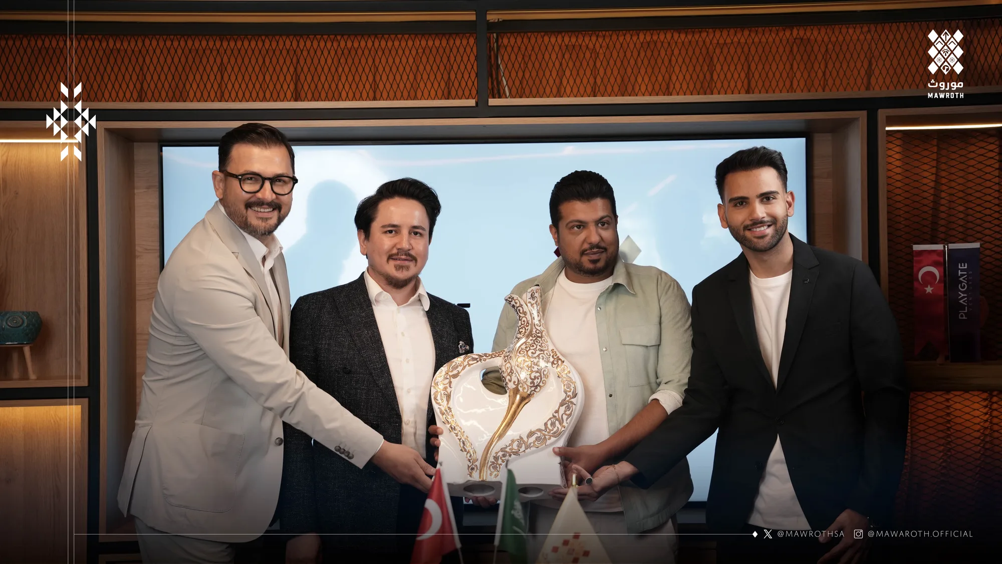 Four signatories exchanging a decorative ceramic vase gift after the partnership agreement signing in Istanbul