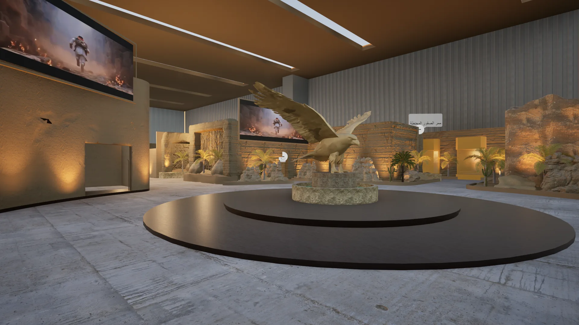 Wide-angle view of the main exhibition hall showing the central falcon sculpture on a circular platform, flanked by cinematic video screens and desert landscape installations