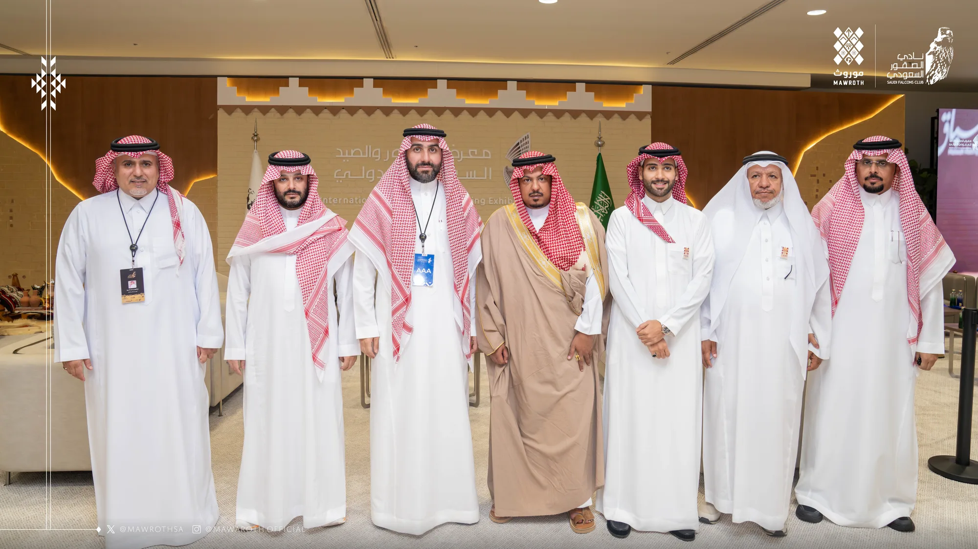 Seven-person delegation group photo at the Saudi International Falcons and Hunting Exhibition 2025