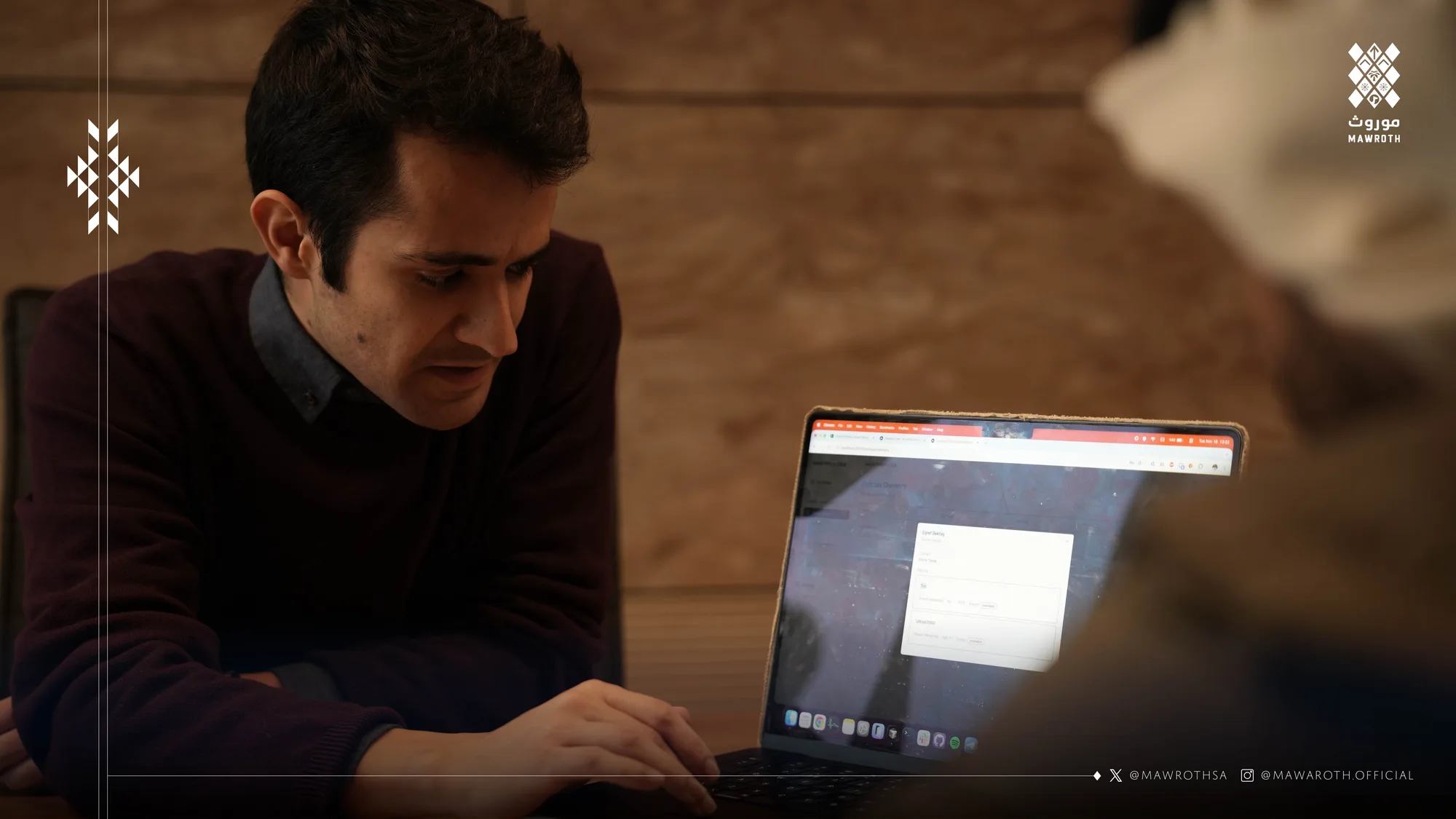 Nodeflam technologist working at a laptop during the collaboration session, reviewing project materials
