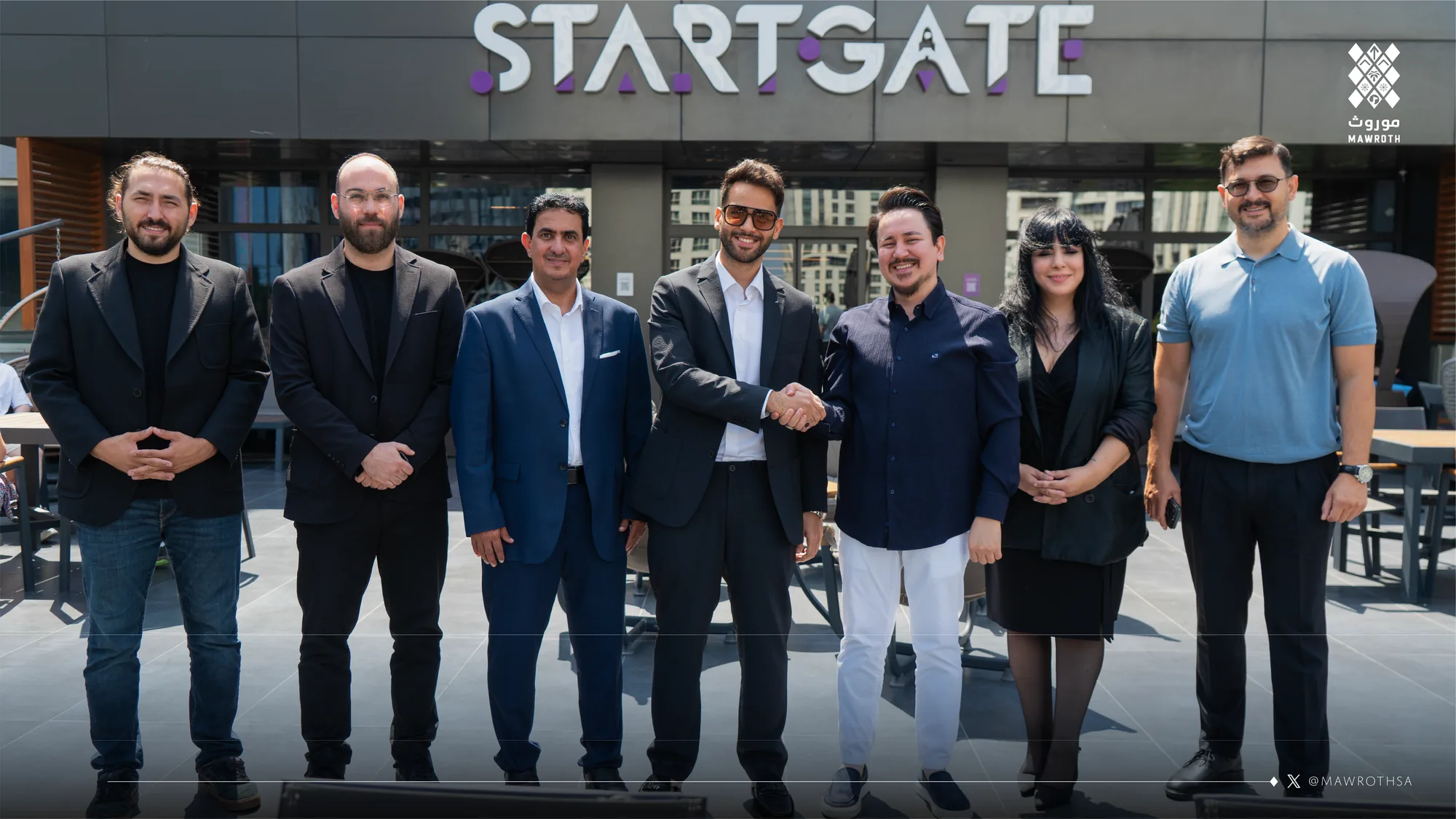 Mawroth and StartGate delegations posing together outside StartGate headquarters in Istanbul, handshake at centre