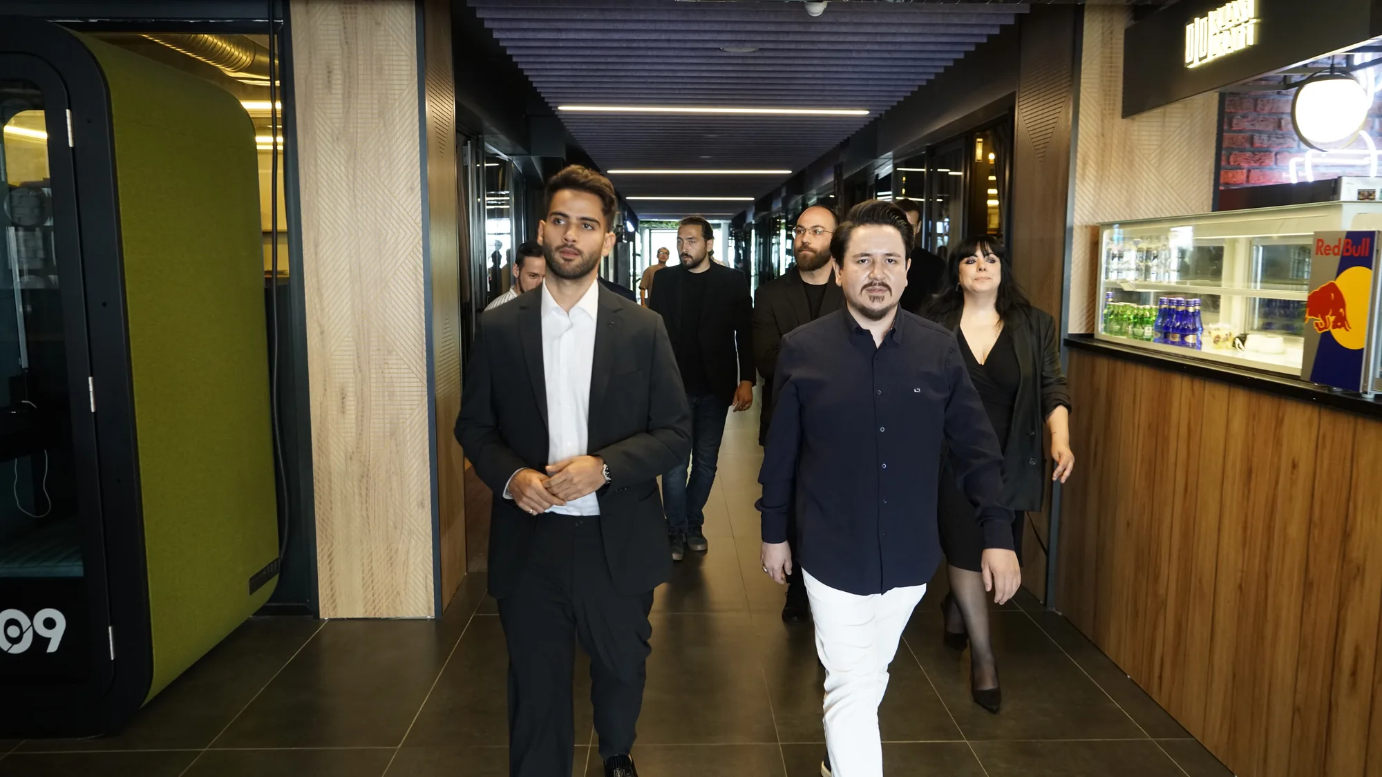 Mawroth and StartGate delegations walking through StartGate's modern office corridor in Istanbul